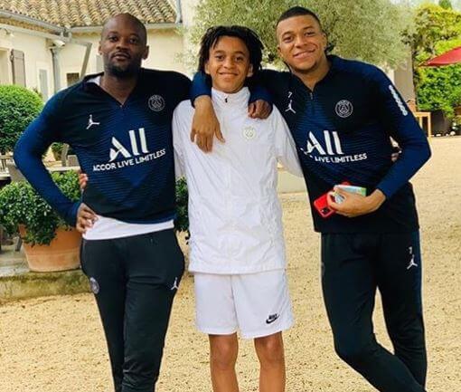 Jires Kembo Ekoko with two brothers, Kylian Mbappe and Ethan Mbappe.